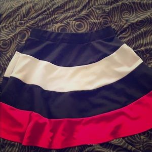 Pink black and white skirt.